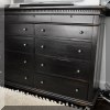 F23. Black double dresser. 50”h x 71”w x 22”d 